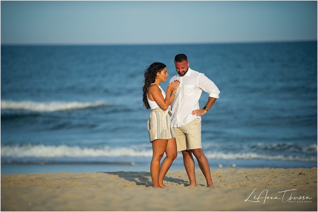 couple look at engagement ring together after proposal