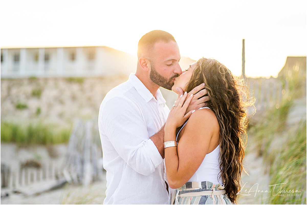 couple kiss on beach after surprise proposal on LBI