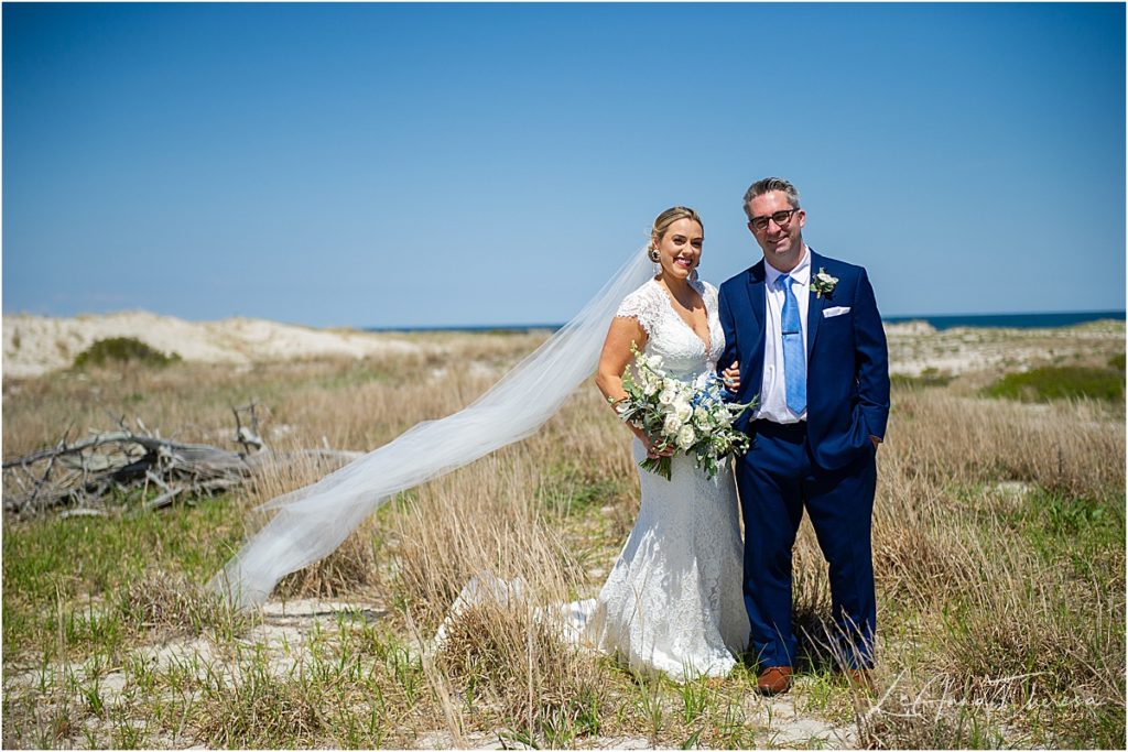 couple smiles at camera for LBI wedding 